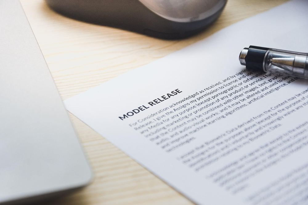 A pen resting on a signed document